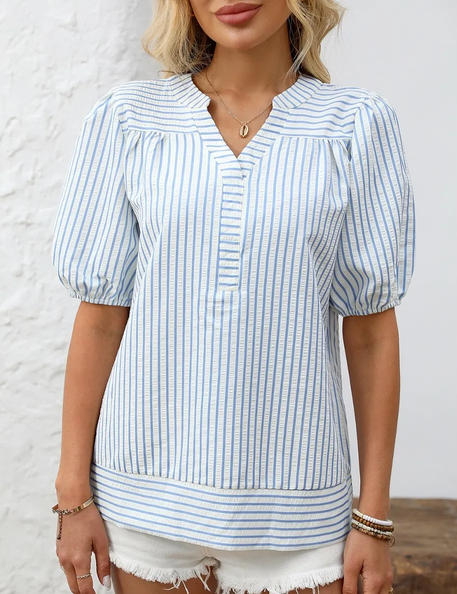 Shirt laid flat on white, the piece under inspection